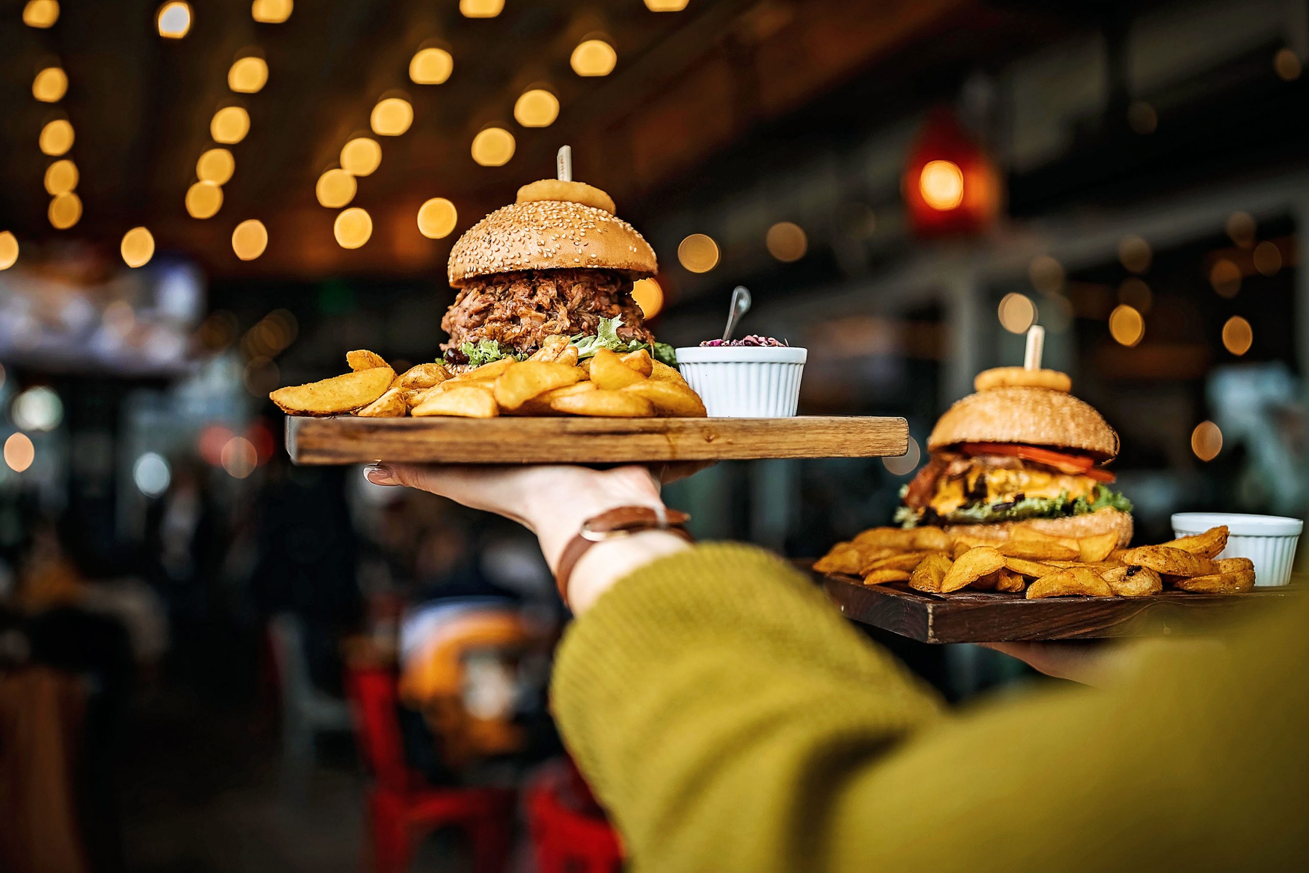 Woman carrying burger